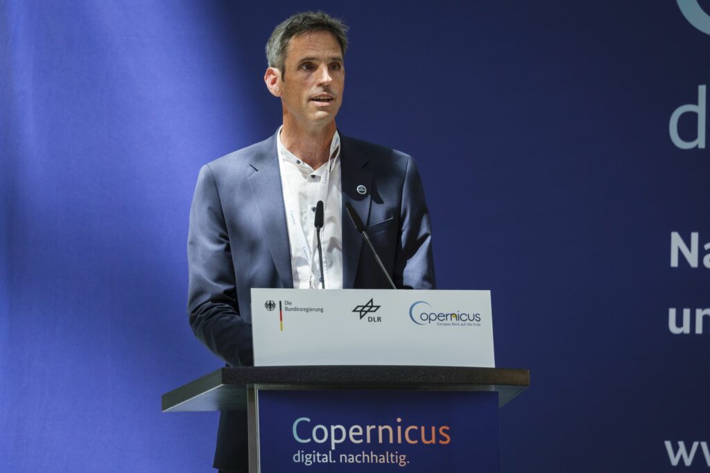 Jörn Hoffmann during a speech at the National Remote Sensing and Copernicus Forum in Berlin. Hoffmann leads the outreach and engagement of Destinations Earth partners.